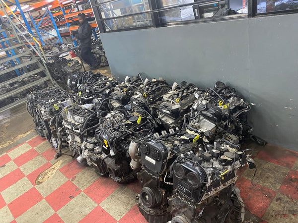Stack of used car engines 