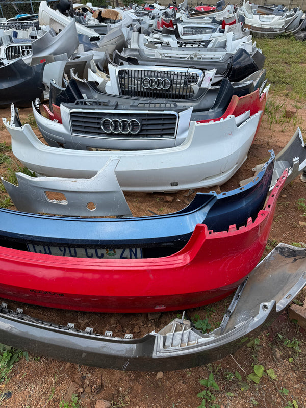 Stacked second hand Audi car bumpers in Johannesburg